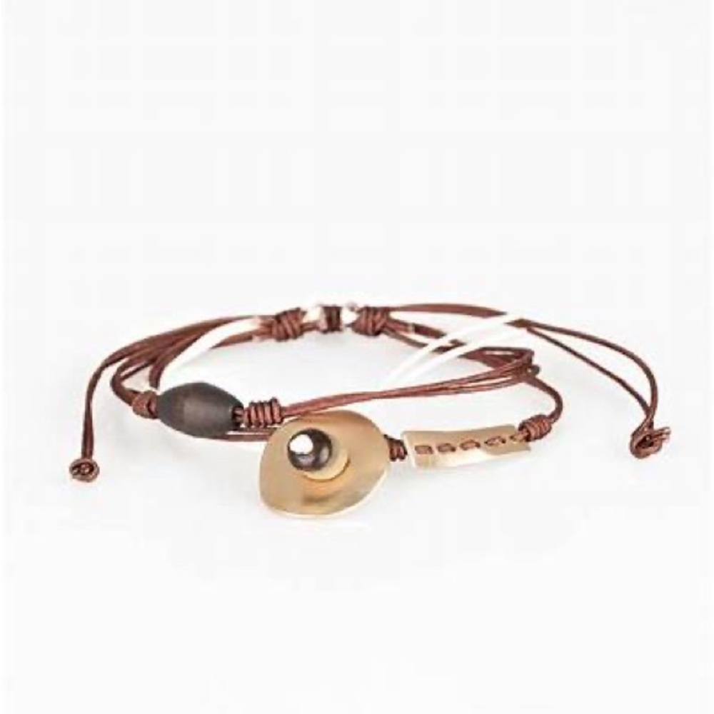 Brown and white cording adjustable sliding knot bracelet.